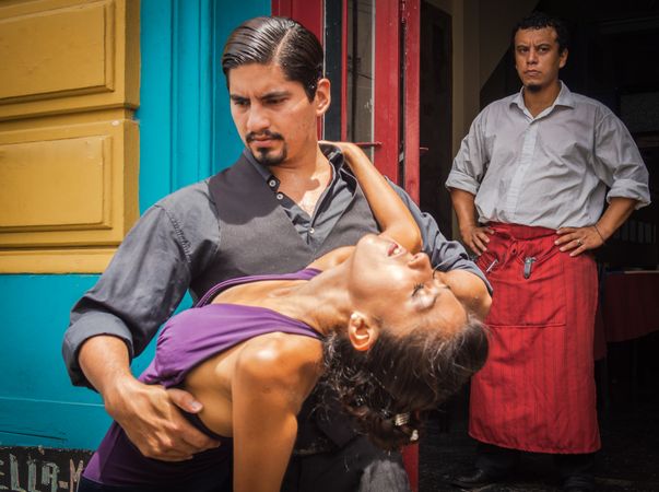 Buenos Aires, Argentina February, 01 2014: Couple dancing on street to guitar music