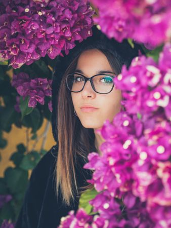 Woman on background of stunning violet flowers