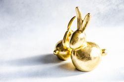 Easter holiday card concept with two ornamental golden figures