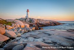 Lighthouse on rocks during sunset in Halifax, Nova Scotia, Canada 0Vxak4