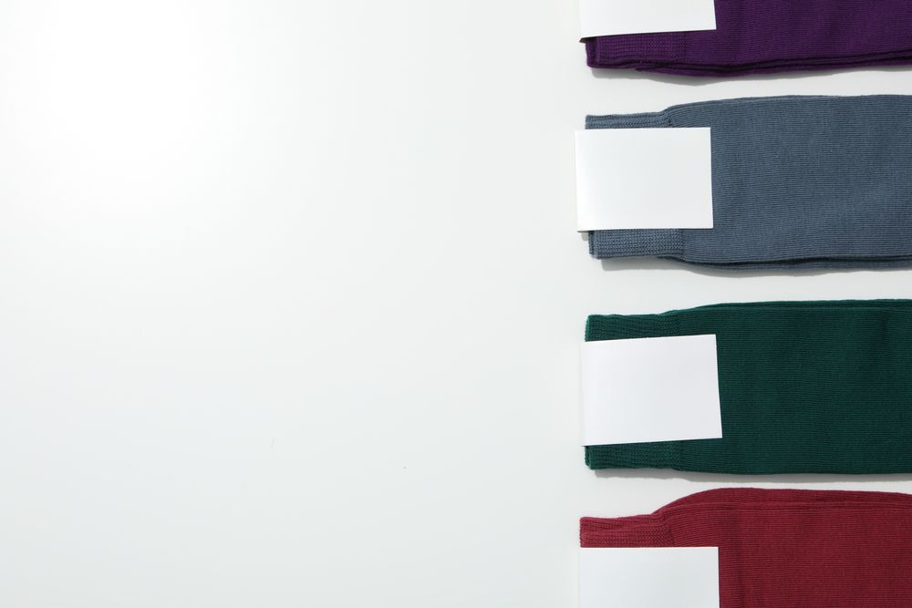 Multicolored high socks on a light background.