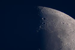Waxing Moon detailed view with craters captured during nighttime observation.