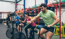 Athletes doing air bike indoor
