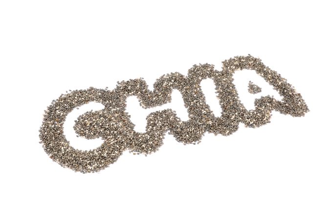 Word Chia layout of chia seeds, isolated on blank background