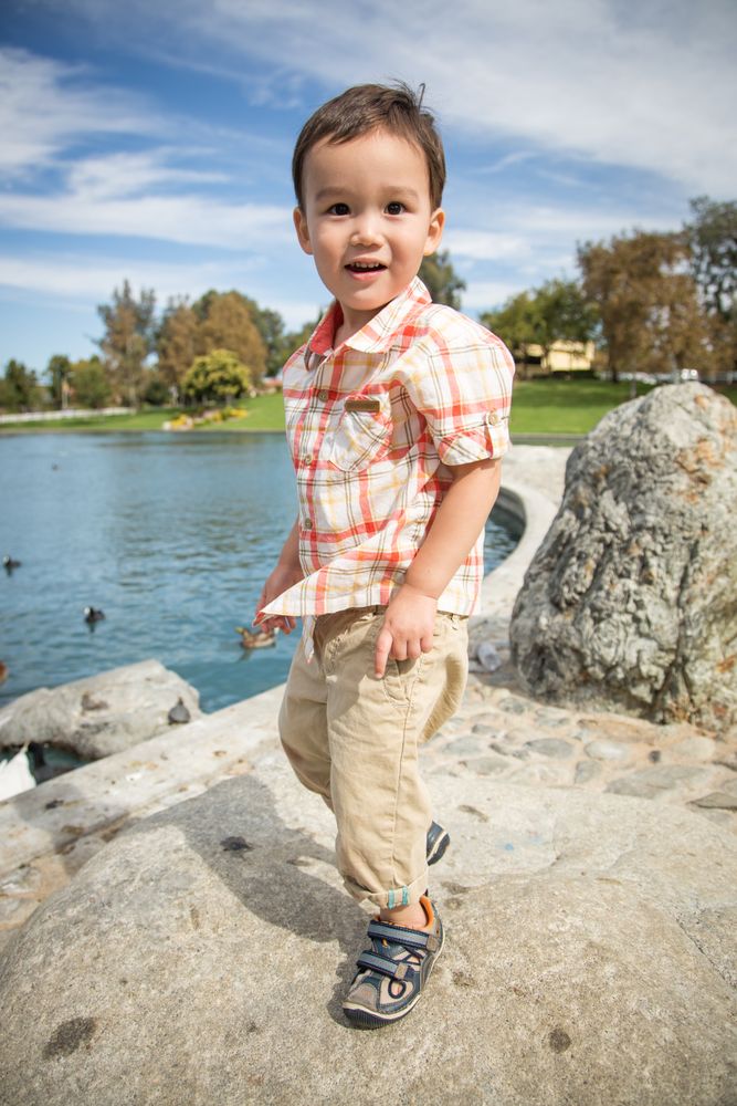 Boy Having Fun at the Duck Pond.