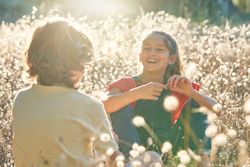 Smiling girl looking at friend in countryside