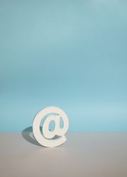 Internet “at” symbol on blue background