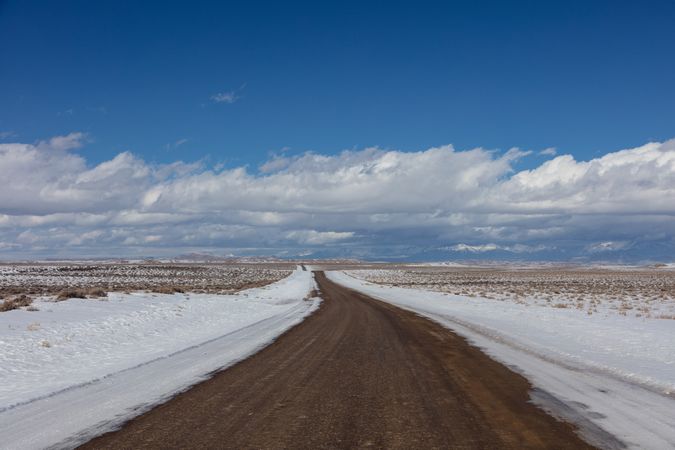 Rural road through rugged and remote Sweetwater County, Wyoming in wintertime
