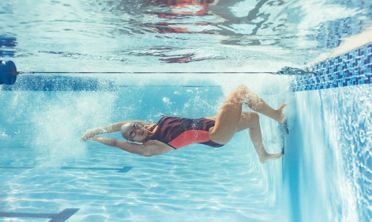 Female swimmer in action inside pool