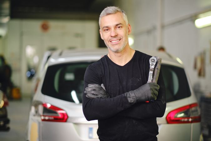 Male mechanic with tools in garage