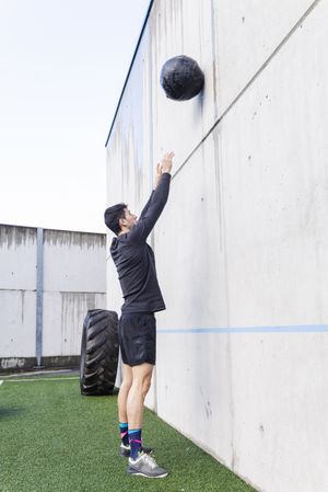 Man training with ball near wall