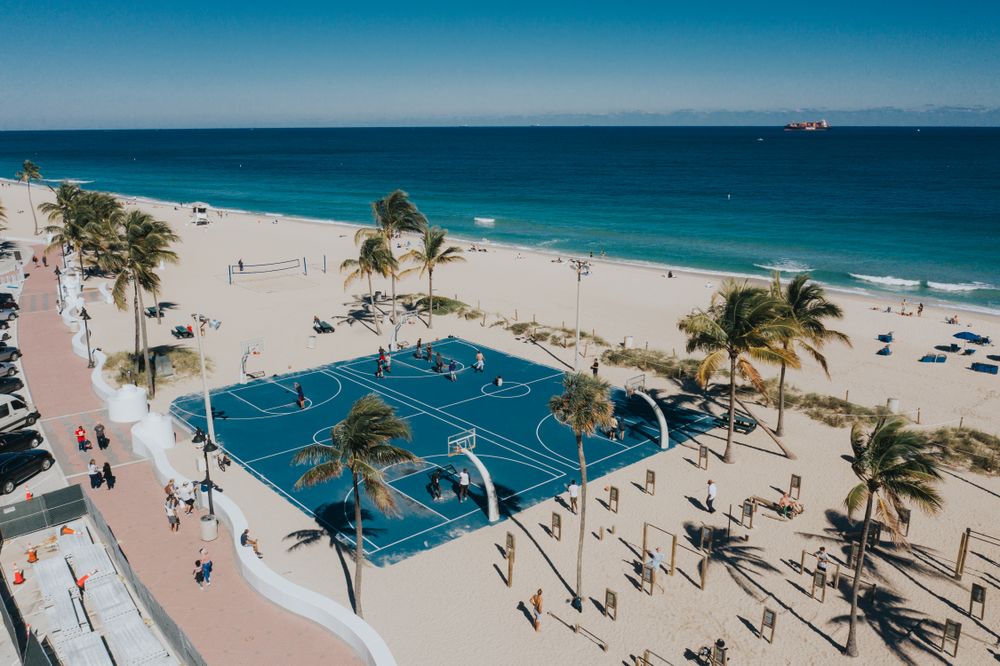 People playing in basket court at the beach