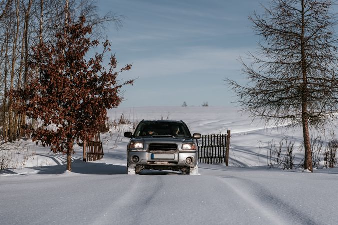 Car driving on snow field