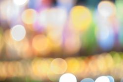 Defocused abstract bokeh lights christmas background, blur of bokeh circle light christmas festive backdrop concept.