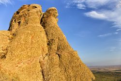 Rough orange rocks in picturesque valley