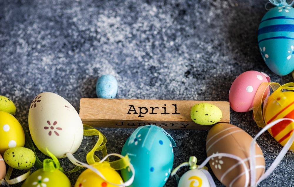 Easter card concept of grey table with decorative small eggs