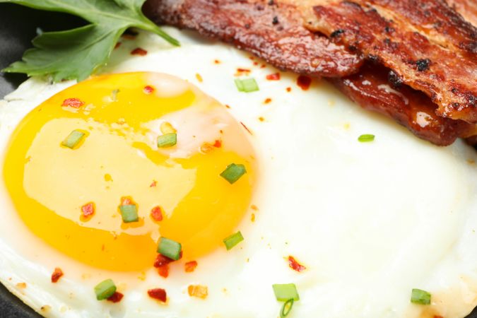 Close up of fried egg yoke on breakfast plate
