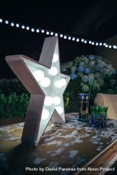 Star lamp with light bulbs over table 4ZeKaA