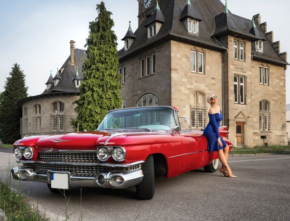Red vintage car with a chic woman