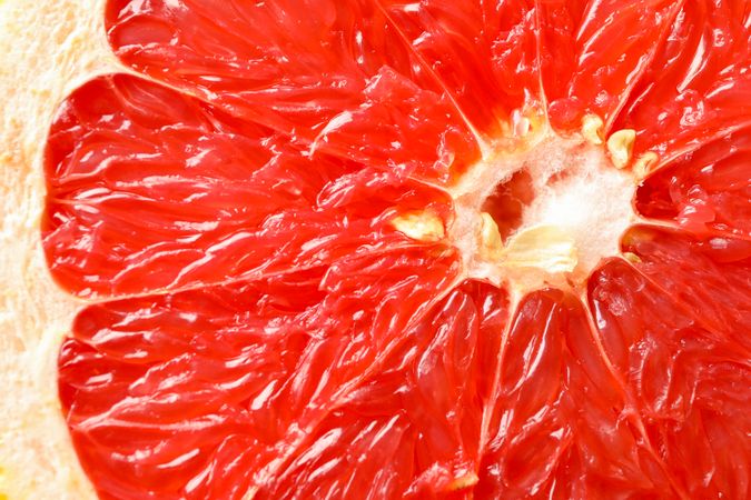 Grapefruit texture on plain background, close up