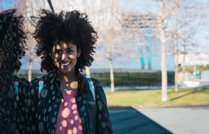 Portrait of Black woman with afro hair.