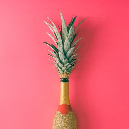 Champagne bottle with pineapple leaves