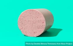 Homemade baloney isolated on a green background 4dx8r4