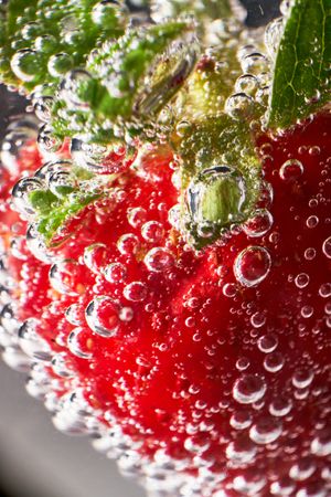 Fresh strawberry with transparent bubbles