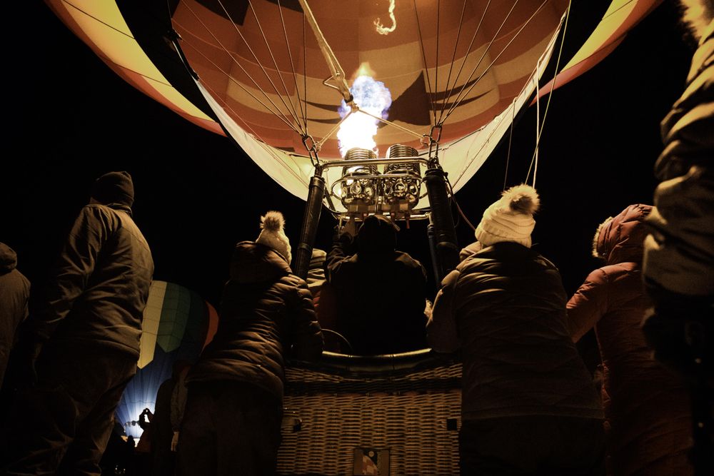 Hudson, WI, USA - February 8th, 2020: Hot air balloon being inflated for take off at dusk
