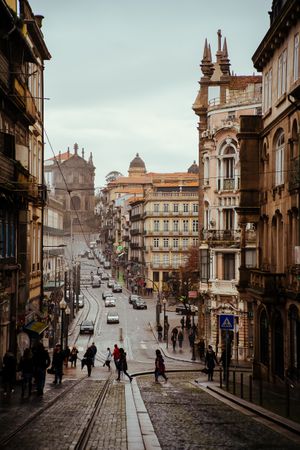 PORTO, PORTUGAL - February, 11, 2019 : People crossing old city street