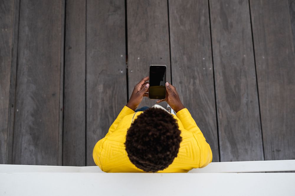 Tranquil female using mobile phone