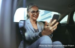 Female Entrepreneur Doing A Video Call With Mobile Phone While Sitting ...