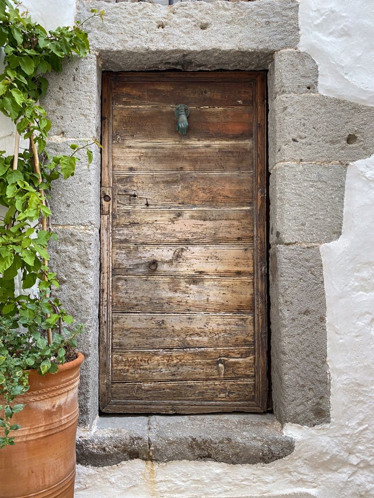 Patmian wood door with hand knocker