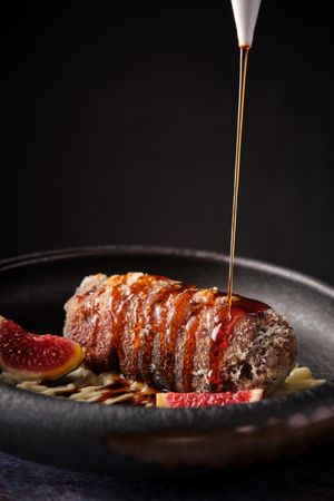 Delicious pork meat with sauce served in plate