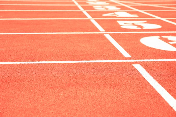 Start of red athletic track with numbers, space for text