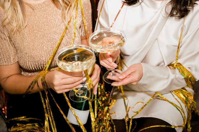 crop of woman at Party Making Champagne Toast Together