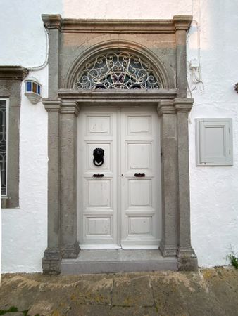 Patmian door with lions head knocker