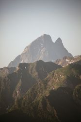 Majestic mountains range in clouds