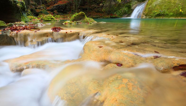 Amazing waterfalls of aquifer with bright vegetation