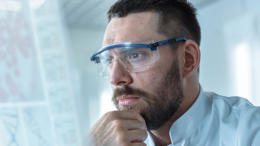 Headshot of a Male Scientists Working on the Transparent Display Computer.