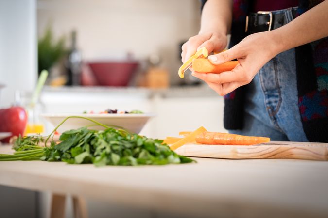 Woman preparing vegetable salad