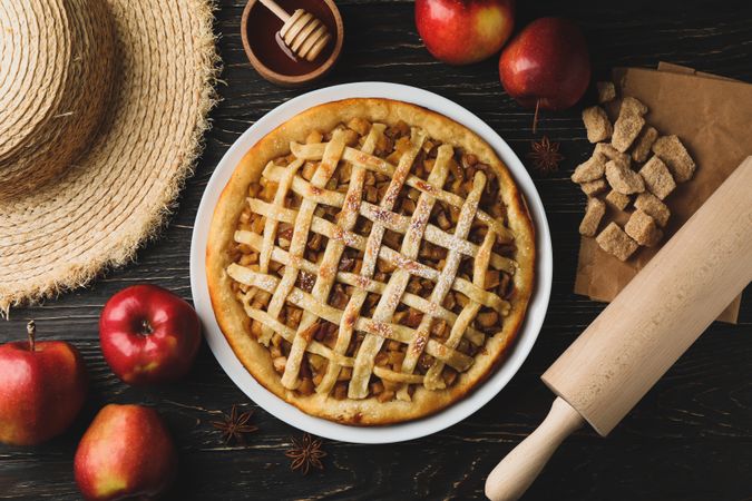 Composition with apple pie and ingredients on wooden background. Homemade food