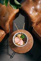 Bowl of delicious ramen soup served in restaurant