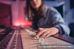Woman hands mixing audio in recording studio 0g7w70