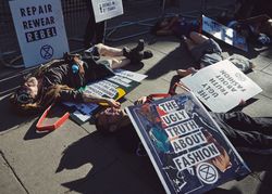 London, England, United Kingdom - September 15th,2019: Man in stream punk goggles lying in protest