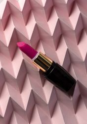 Lipstick on raised pink chevron. Product and make up concept