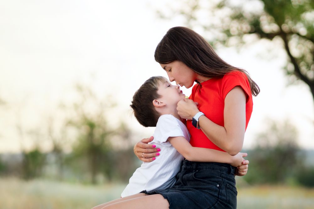 Affectionate mom with son outdoor