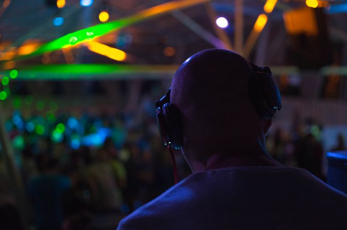 DJ wearing headset in party
