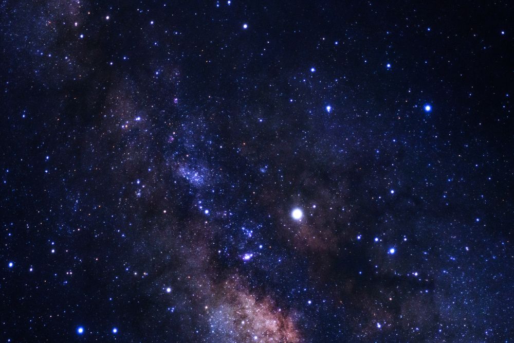 Milky way galaxy with stars and space dust in the universe, Long exposure photograph, with grain.