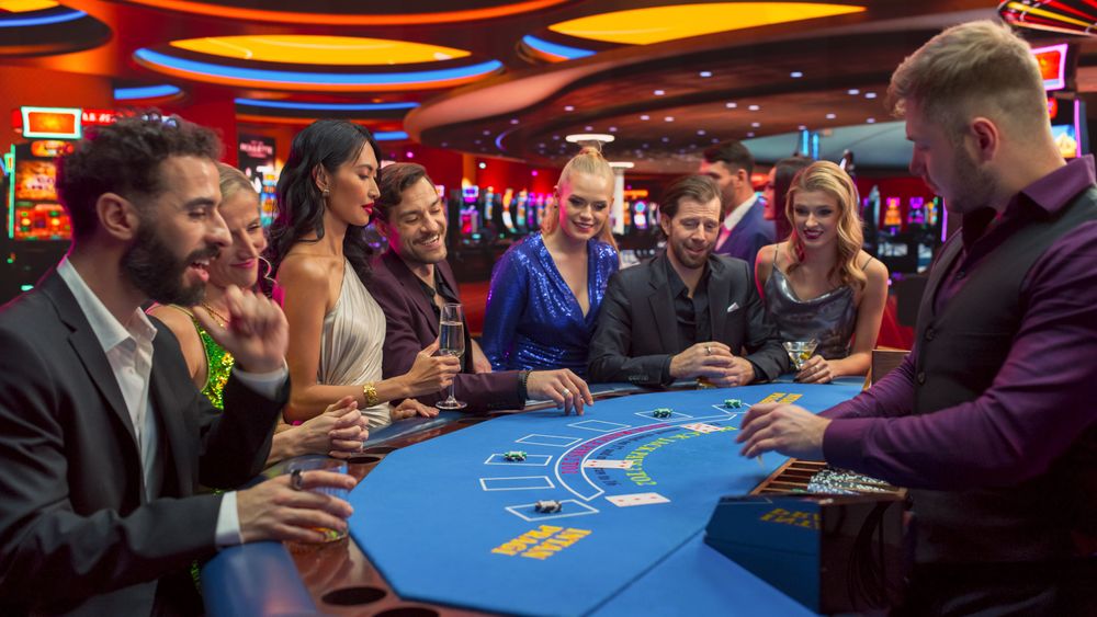 Portrait of People Cheering and Celebrating the Winner of a Blackjack Game in a Modern Casino.